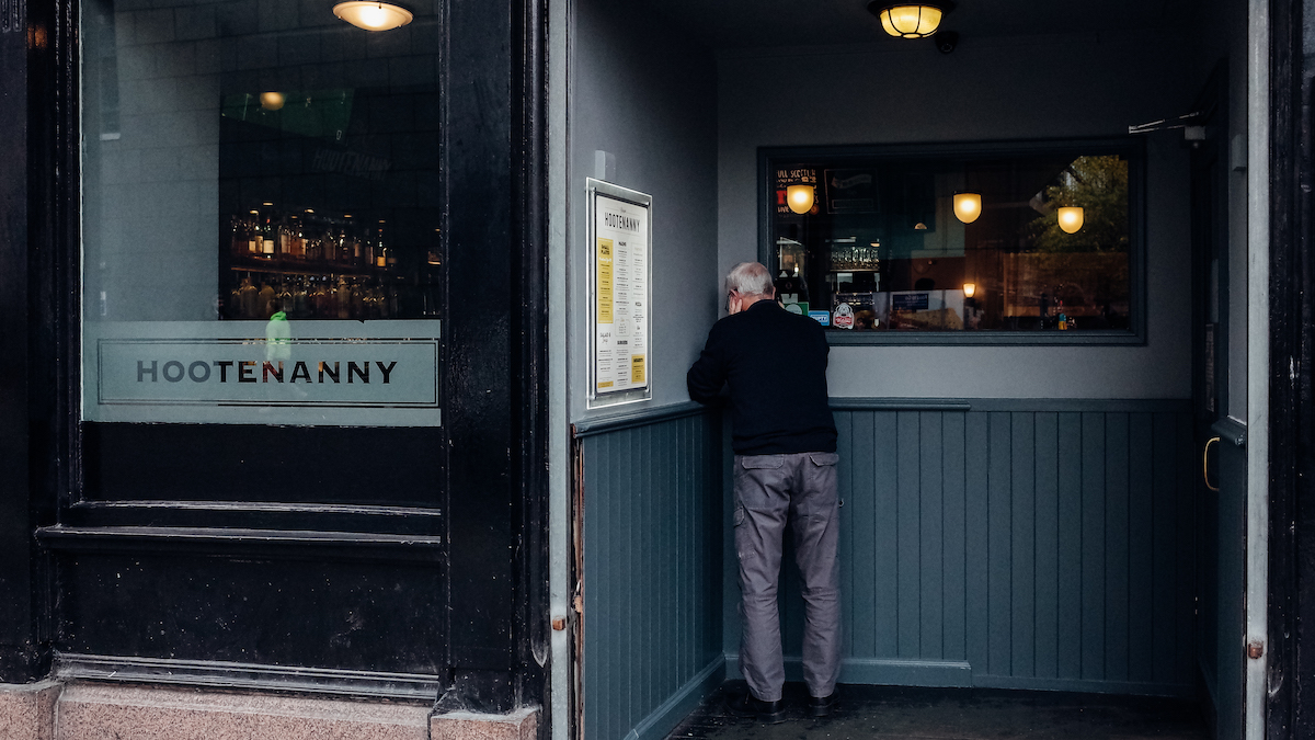 The Glaswegians Hootenanny pub man talking on the phone
