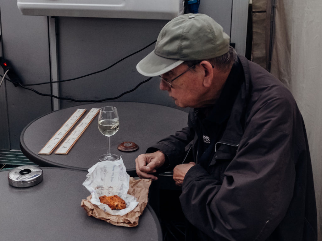 A man having lunch in Frankfurt's outdoor market