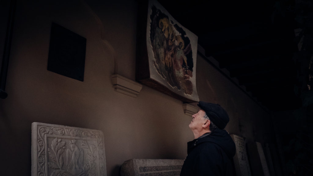 Man staring at a wall at Stavropoleos Church