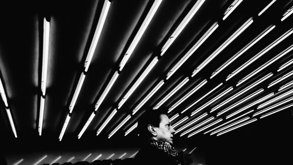 A man walking in Berlin - Black and white night street photography