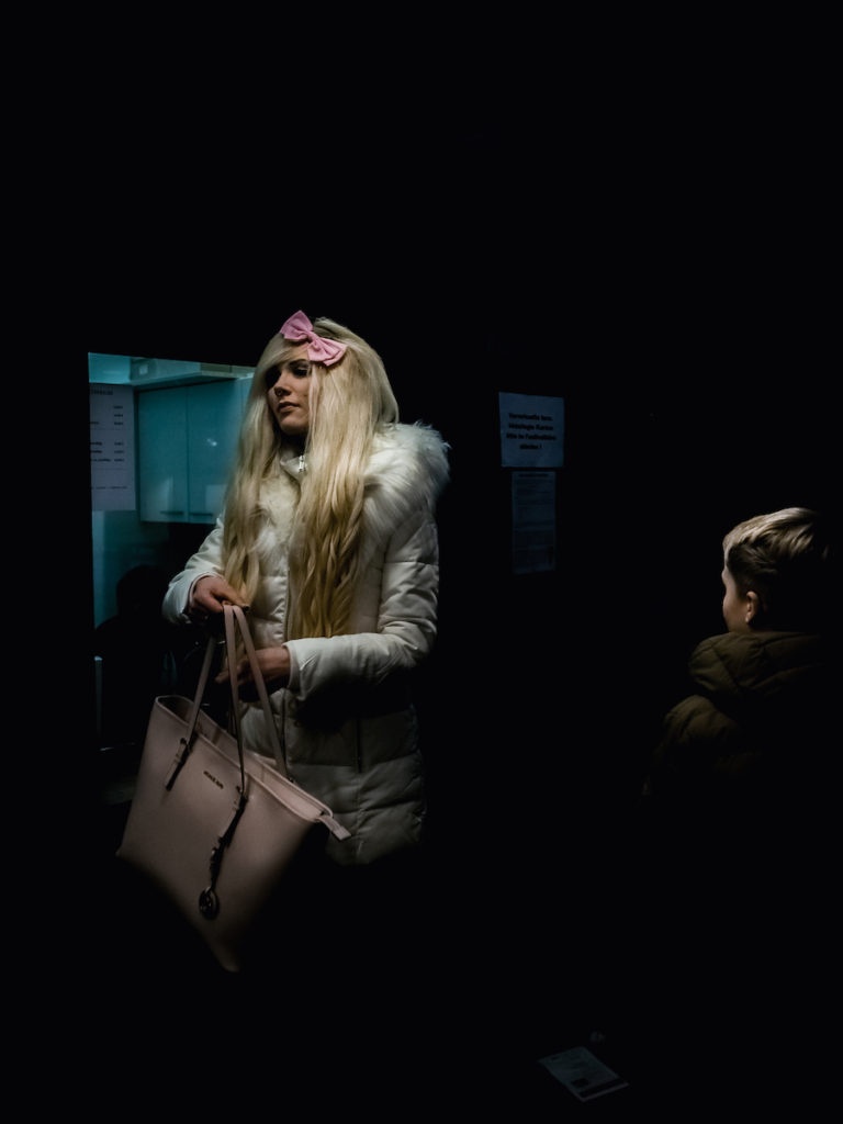 Street photography at night woman and teenager