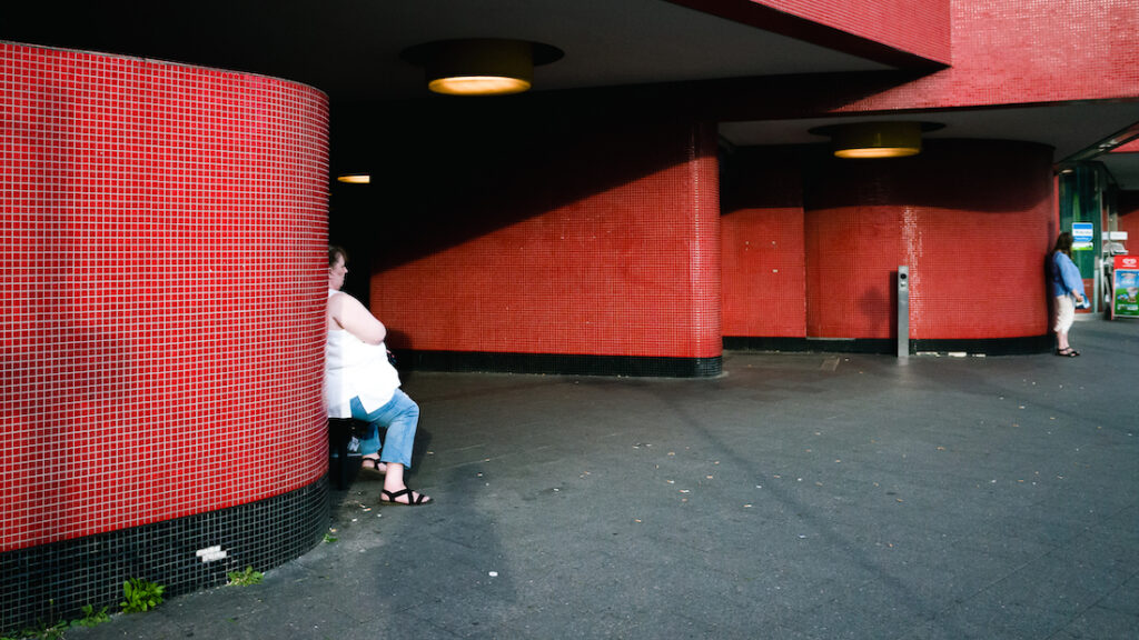 10 interesting facts about Berlin and where to stay: woman outside of U-Bahn
