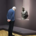A man watching art at the Athens National Art Gallery - 2022 Year review