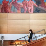A woman walking down the stairs at the Athens National Art Gallery - The 2022 Year review smartphone photography