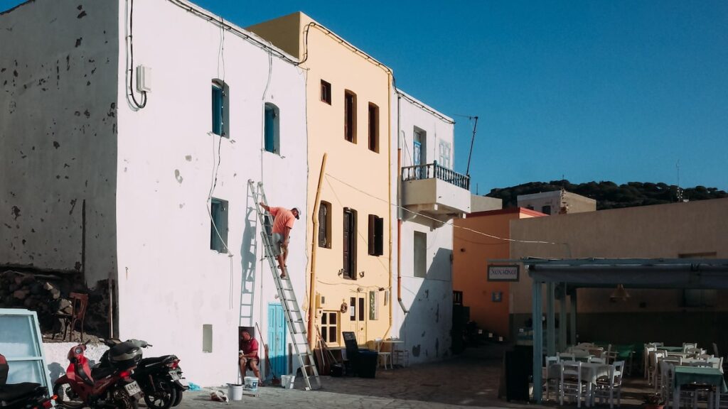 Two men working on a building in Nisyros