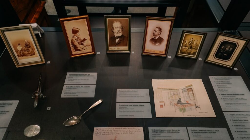 A photo depicting the personal belongings of the Brothers Grimm together with pictures.