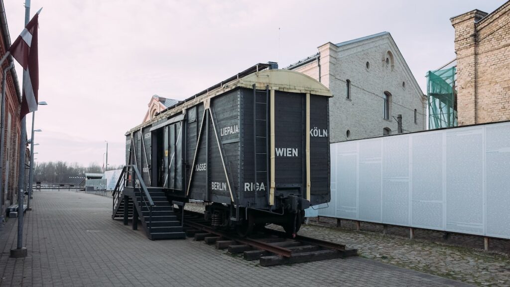 An image depicting a wagon used during World War II to deport Jews to concentration camps. Today is stands in the Riga Ghetto and Holocaust Museum and it's one the best things to do in Riga