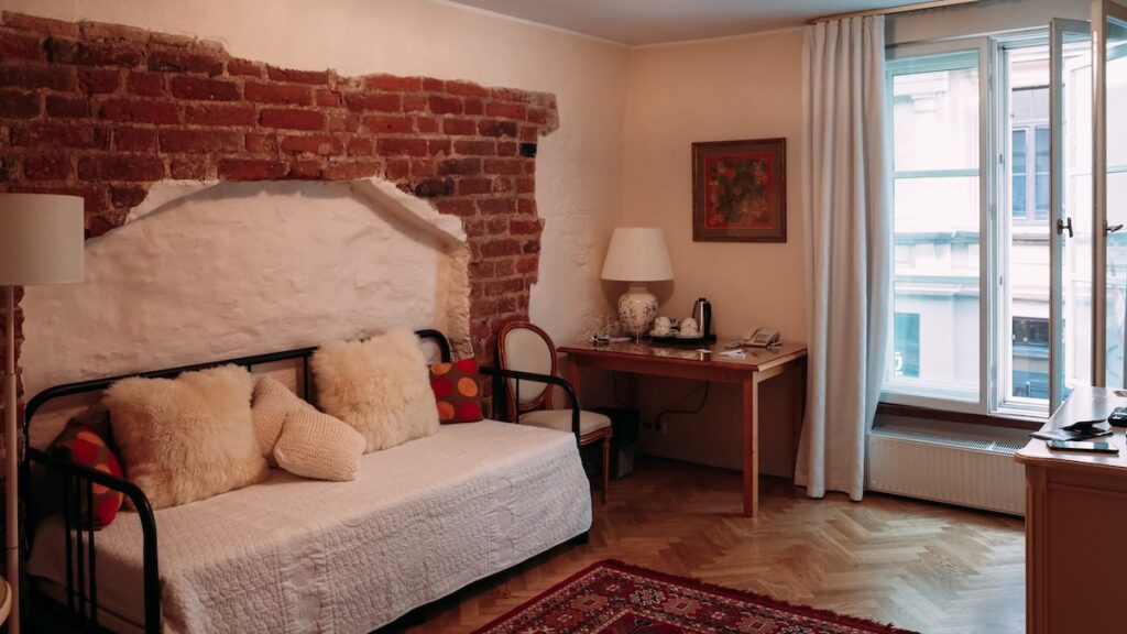 A photo from the interior of St. Peter's Hotel in the Old Town of Riga, featuring a 15th-century original wall