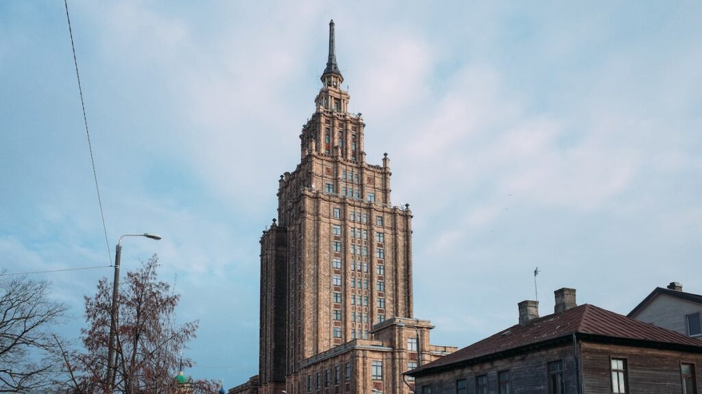 A photo depicting the Latvian Academy of Science, also known as Stalin's Cake, due to the Stalinist architecture. One of the best things to do in Riga is to see the view from its rooftop