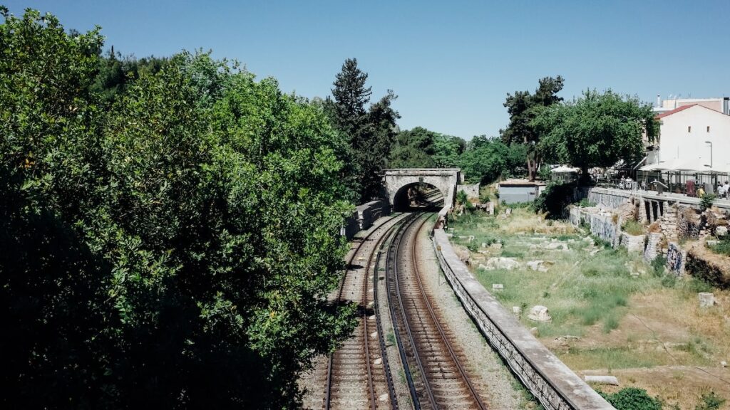 A train line in Monastiraki, Athens, and ancient rocks