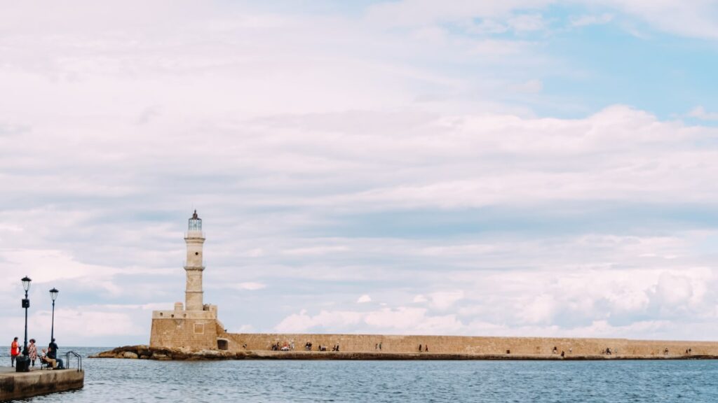One of the easiest ways to get from Athens to Crete is to travel by ferry to the port of Chania, which is depicted in the image