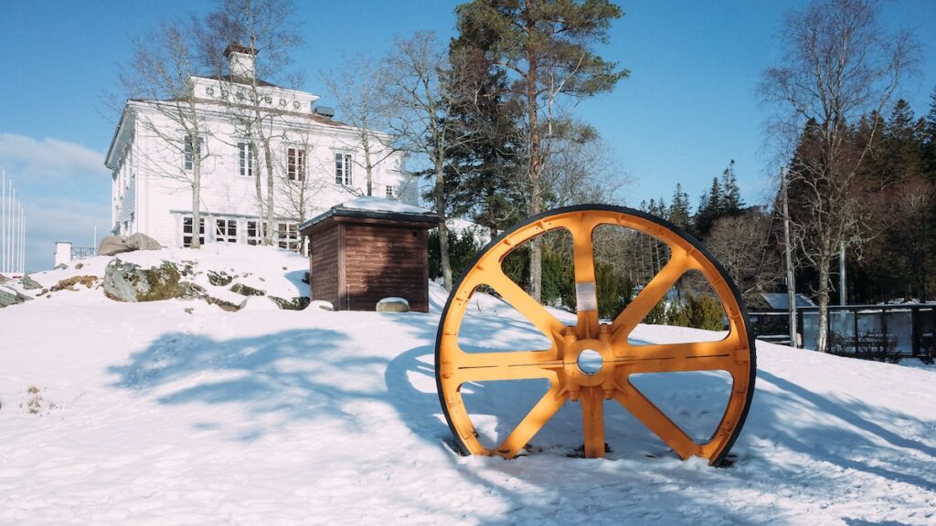 A yellow wheel was placed on snow-covered Mount Floyen in Bergen, Norway. It's a must-see thing for your 3 days in Bergen.