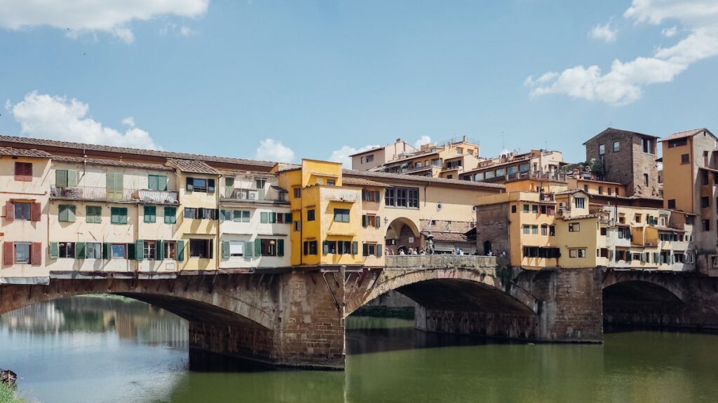 The Ponte Vecchio Bridge in Florence is an ideal city to start your Tuscany wine tour. The image is the cover photo for an article about the best Tuscany wine tours from Florence written by George Pavlopoulos for the travel blog Letters to Barbara