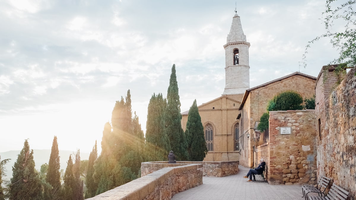 A photo depicting the sunset in Pienza, Italy, the ideal city of the Renaissance. Located in the Val D' Orcia valley, Pienza is a must-see in any Tuscany wine tour in the Chianti region
