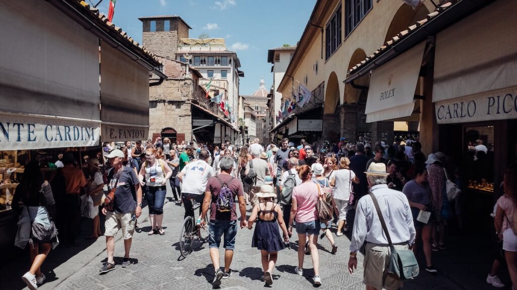 The famous Ponte Vecchio Bridge in Florence, with people strolling along it