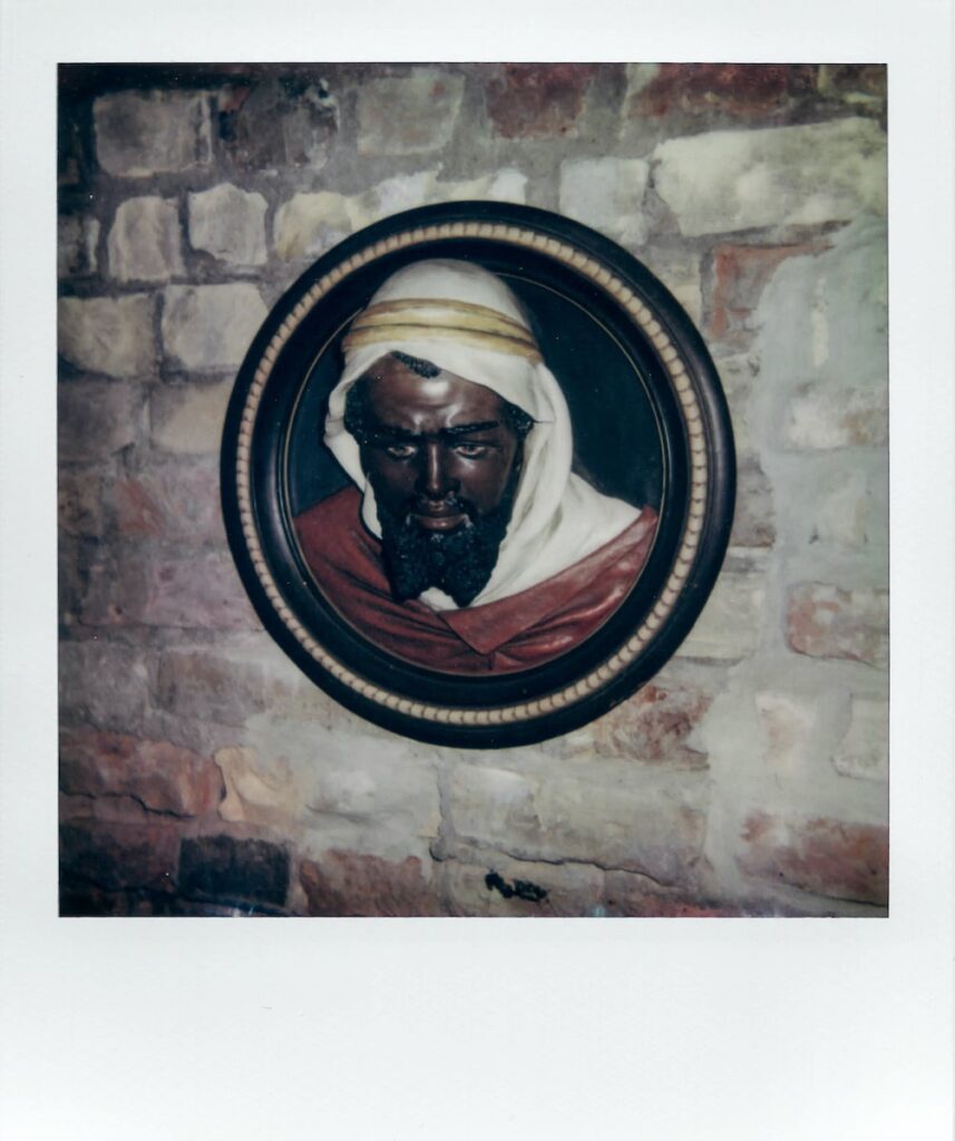 A polaroid photo of Saint Maurice's statue in the House of the Black Heads in Old Riga, taken with the Polaroid Impulse AF
