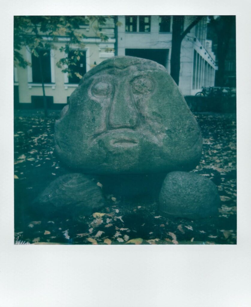 A polaroid image of the Salaspils Stone Head in Old Riga, Latvia, taken with the Polaroid Impulse AF