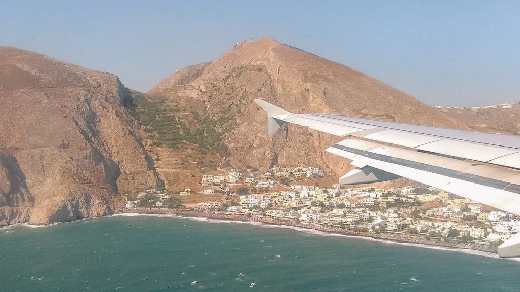 A photo of a plane landing in Santorini, Greece. Domestic flights in Greece operated by Aegean Airlines