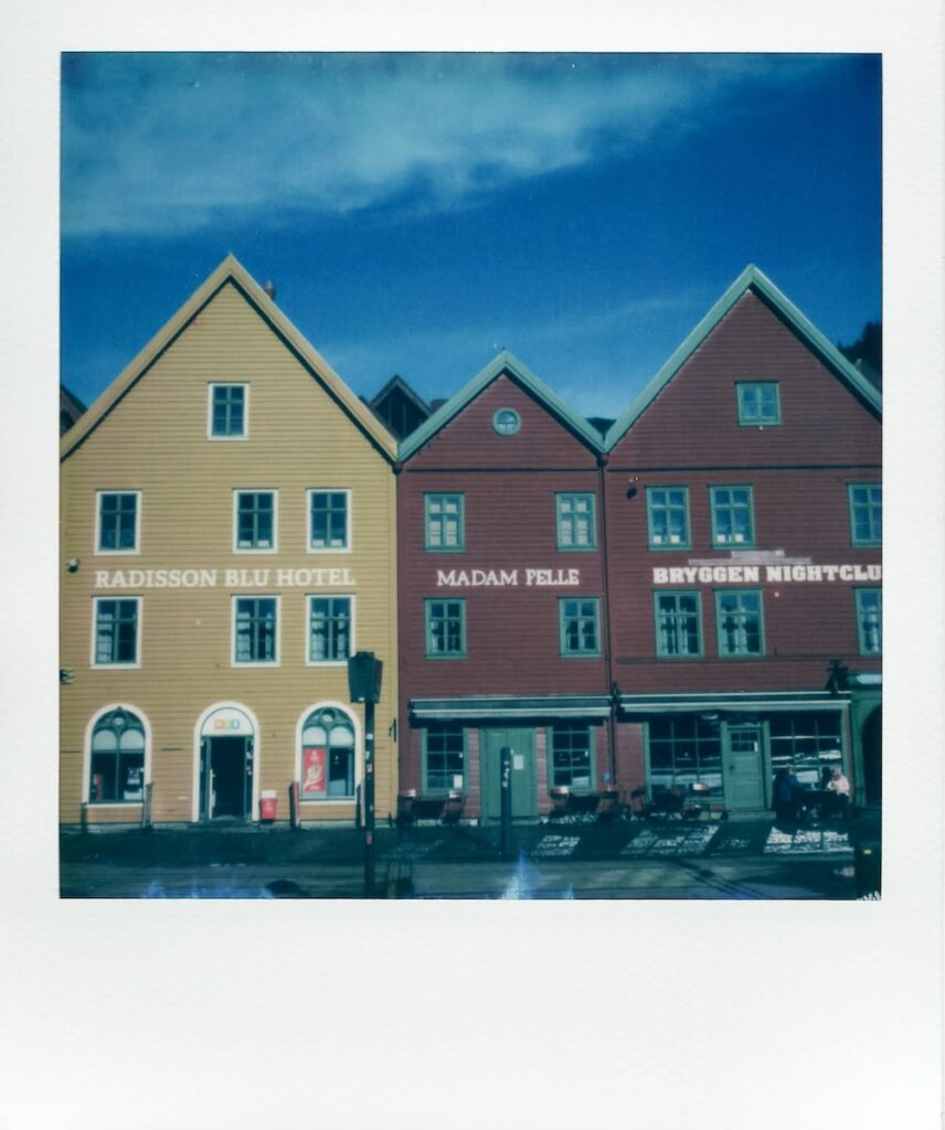 A photo taken with the Polaroid SX-70, showing the colorful wooden houses at Bryggen, the port of the city Bergen