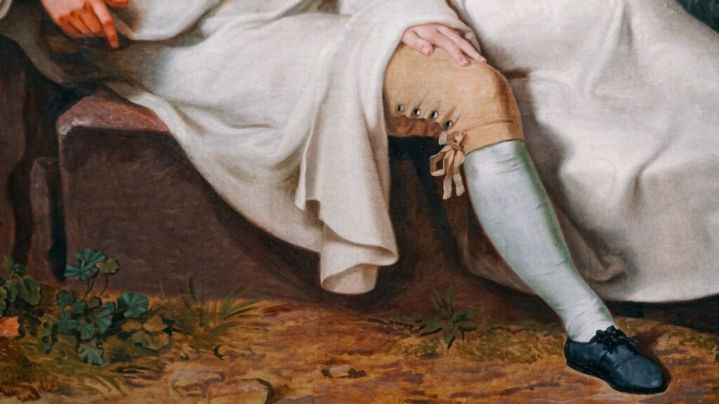A close up photo of a painting by Johann Heinrich Wilhelm Tischbein . The image is famous because it depicts Goethe having two left feet. It is hosted at the Staedel Museum in Frankfurt