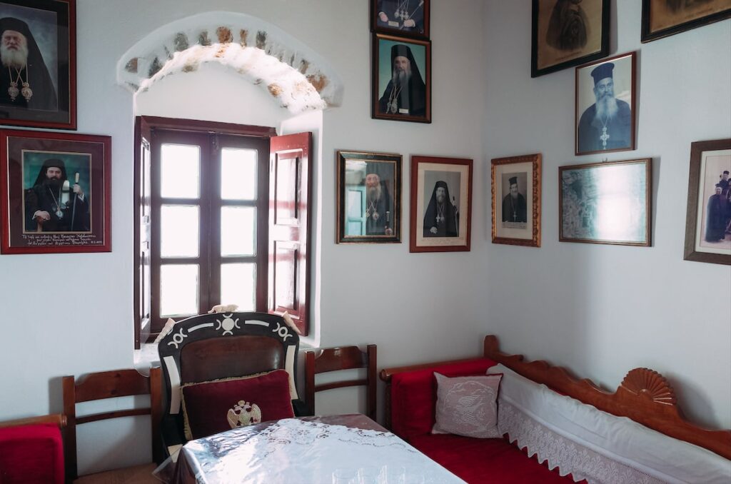 One of the main rooms of the Hozoviotissa Monastery in Amorgos. The walls are decorated with photos of Orthodox priests