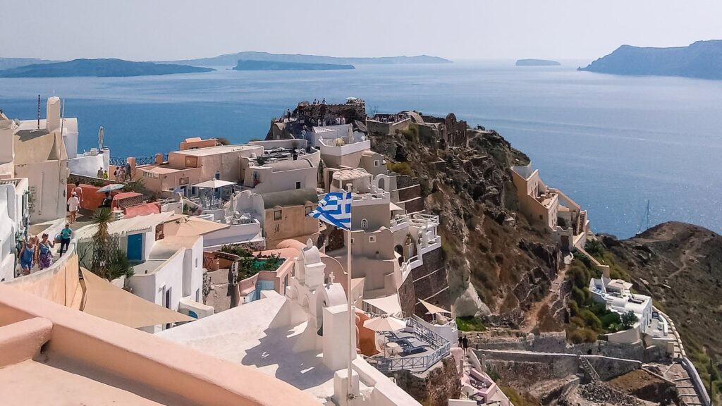 A photo of Oia, Santorini, towards the famous sunset viewpoint. Oia is a must-see location for every Santorini shore excursion.