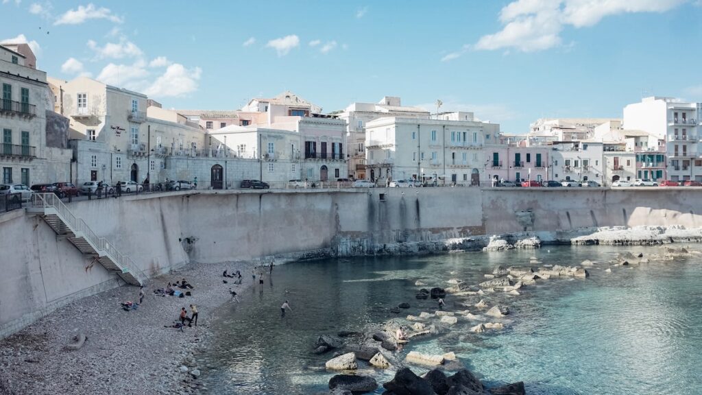 A photo of people swimming and hanging out at beach of Ortygia in Sicily
