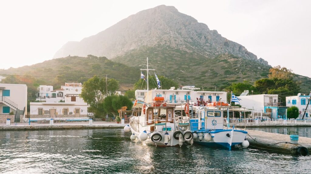 A photo showing the port of Telendos, Greece (Τέλενδος), during sunset