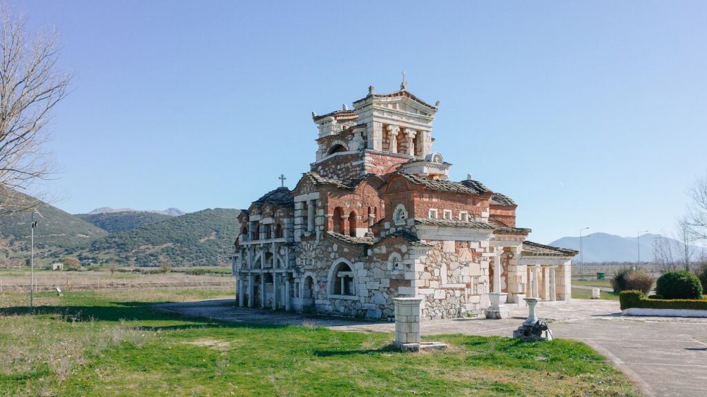 A photo portraying the orthodox church of Agia Fotini Mantineias in Greece from the side. The church combines various Ancient Greek and Byzantine elements and is assumed as one of the most unusual churches in the world.