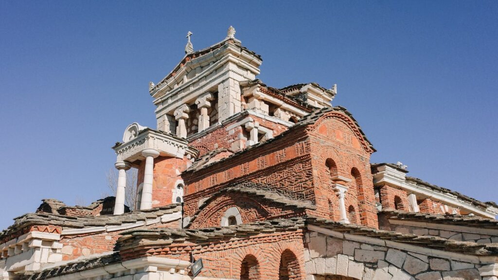 A photo showing a detail from the exterior of Agia Fotini Church in Greece.