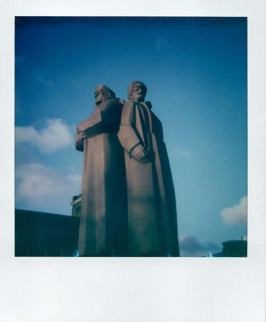 A polaroid of the three riflemen statue in Riga, Latvia, taken with the Polaroid Impulse AF