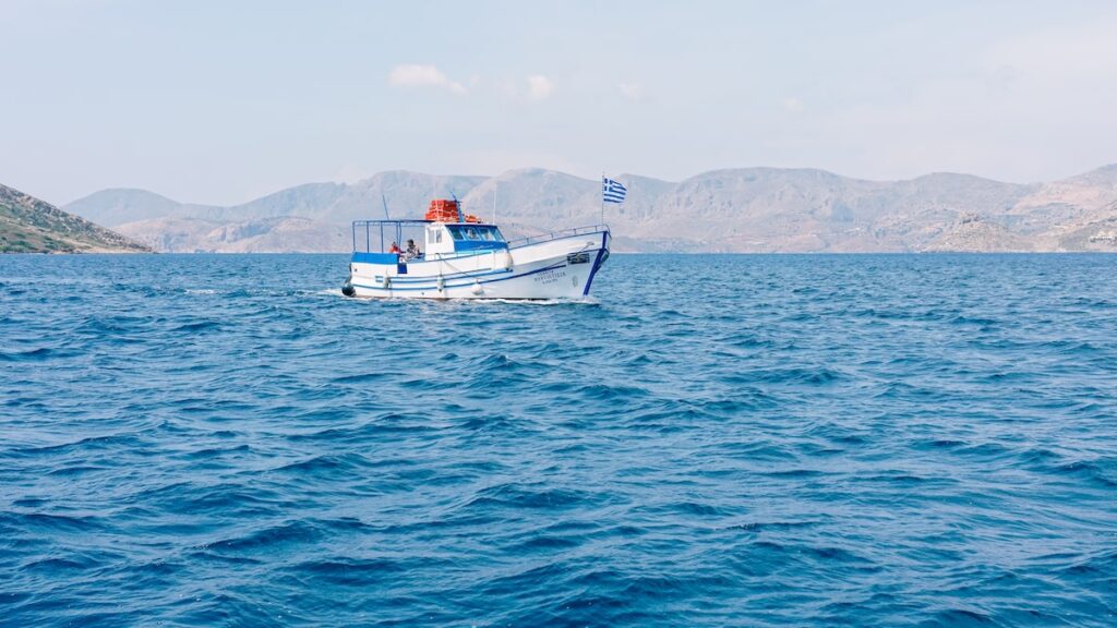 A photo of a boat sailing in the Aegean Sea.