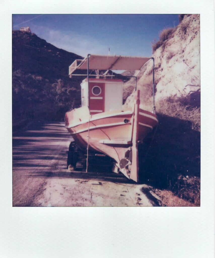 A polaroid of a boat standing ashore in the tiny island of Anafi in Greece. The image is taken with the Impulse AF and it's of the greatest Anafi moments.