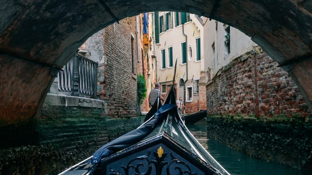 A photo taken during a gondola ride in Venice showing the inner canals of the city
