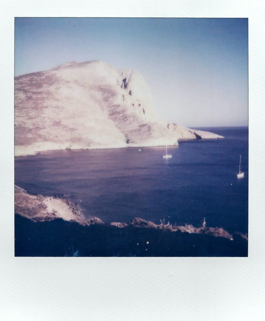 A polaroid showing the landmark of Anafi, the Monolith of Kalamos, which is the second-biggest in Europe after Gibraltar. The image is taken with the Impulse AF.
