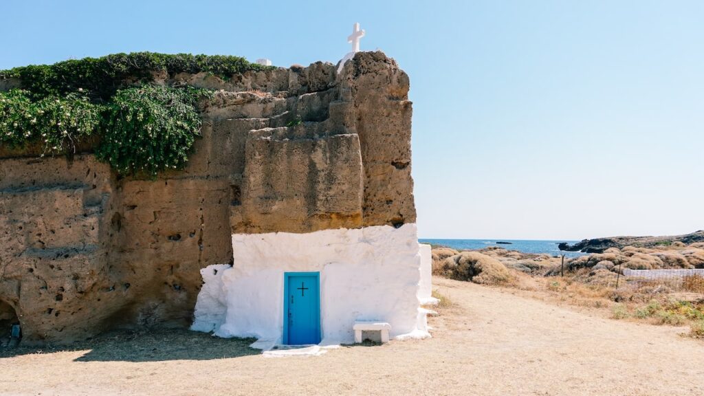 A photo of the Agios Nikolaos Church in Skyros, Greece, carved on a free-standing rock
