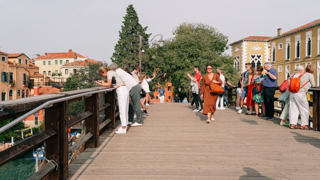 A photo showing people at the Ponte Dell'Accademia in Venice, Italy