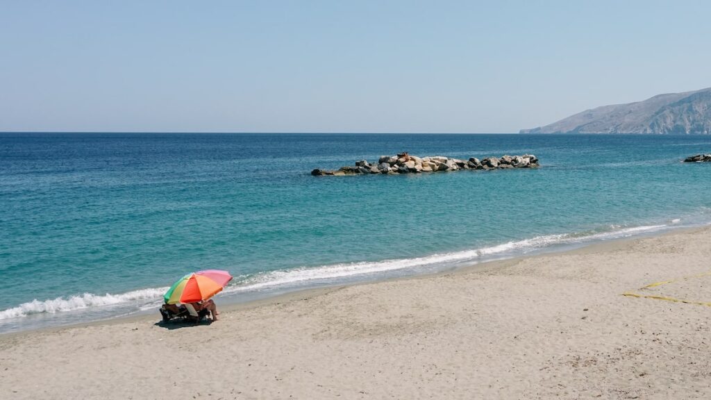 A photo of an umbrella and a breakwater at Magazia