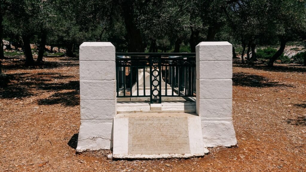 A photo of the Rupert Brooke grave in Skyros, Greece, with the poem "The Soldier" engraved on its front
