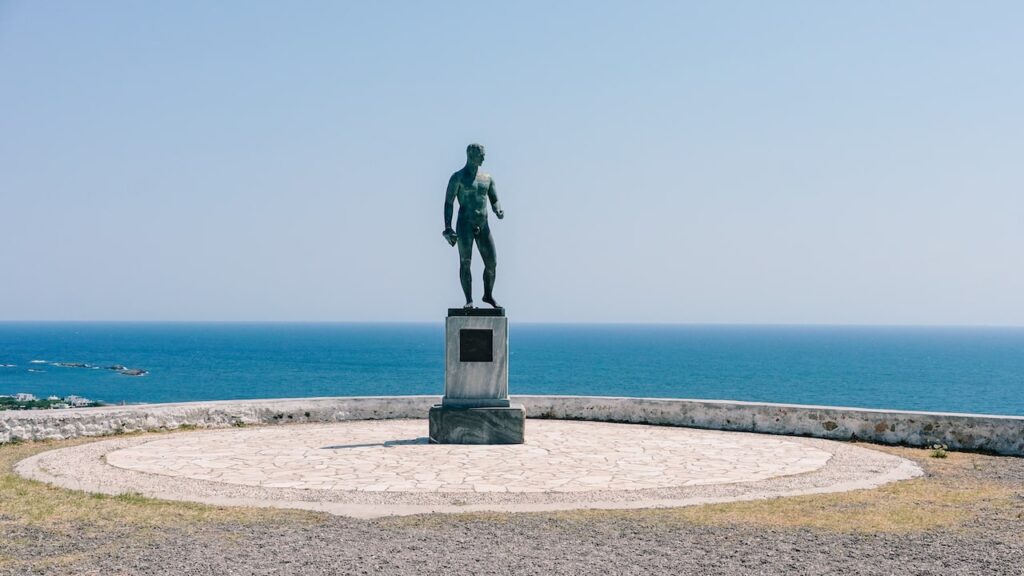 A photo of the Rupert Brooke Square in Skyros, Greece, where the statue of the famous poet overlooks the Aegean Sea