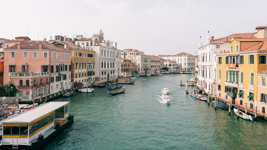 A photo of the Grand Canal as seen from the Accademia Bridge with the Vaporetto station on left