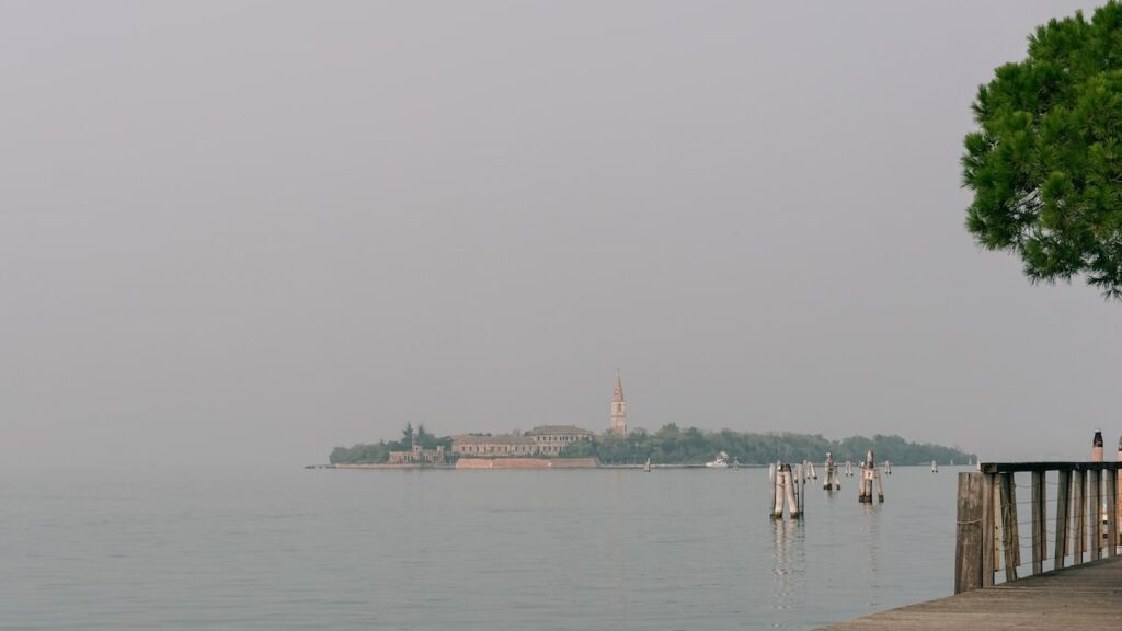 A photo showing the Isola di Poveglia in the Venice Lagoon, taken from Malamocco, Lido