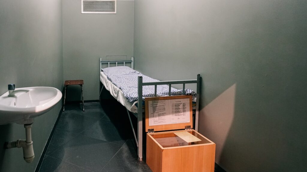 A photo replicating a prison cell during the Wall Years, presented at the DDR Museum Berlin