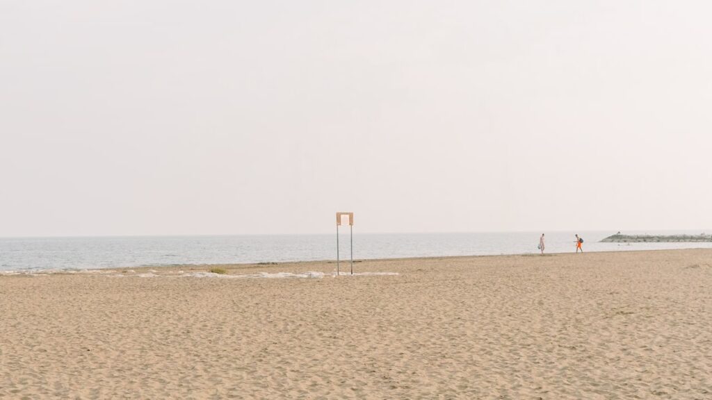 A photo of Lido Beach in early October with two people spending time at the beach