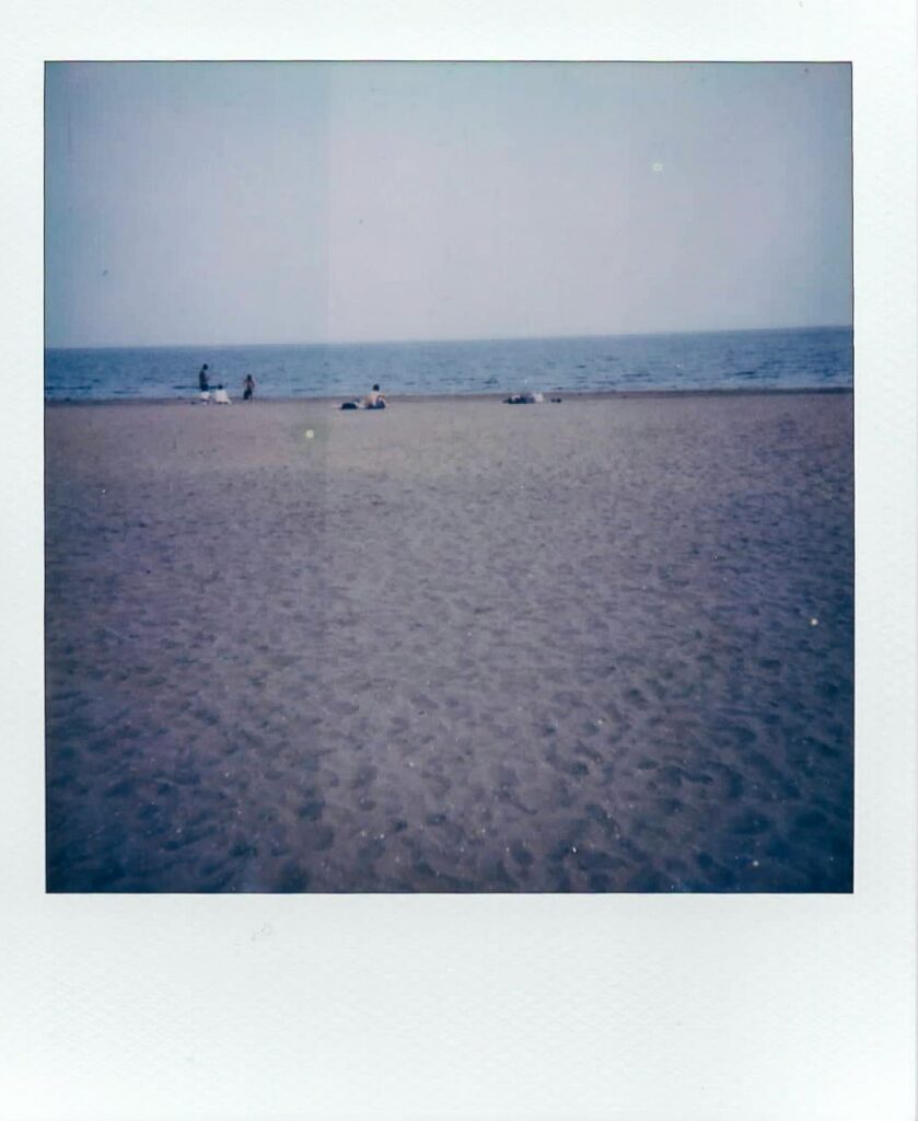 A polaroid showing the beach of Lido, taken with the Polaroid Impulse AF for the Venice Polaroids article