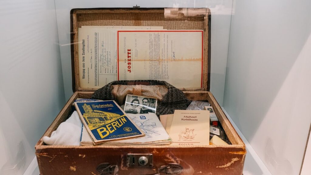 A photo showing a suitcase full of documents, passports and paperwork, replicating the suitcases of people fleeting from East to West Berlin during the Cold War