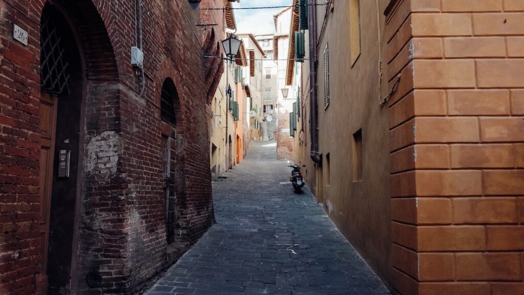 A typical narrow street in Siena, Italy