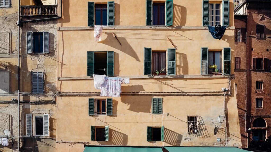 A close-up photos of windows in Siena, Italy