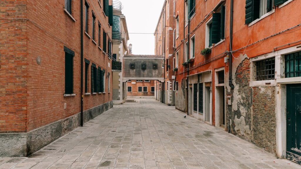 A quiet street in Castello, Venice, with red brick buildings