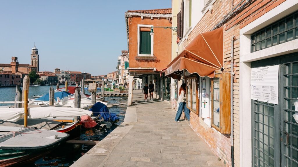 The waterfront promenade of Murano, one of the best places to stay in Venice for returning visitors